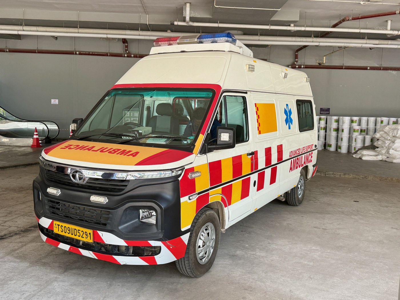 Arovia patient transportation ambulance vehicle parked outside a healthcare medical facility